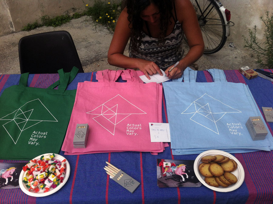 ACMV's table at at COSMOS, during the opening week of Les Rencontres d'Arles, 2014